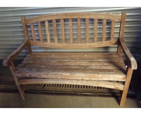 Teak slat backed garden bench. (B.P. 21% + VAT)Minor movement, seems complete.