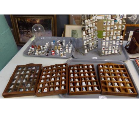 Large collection of ceramic, wooden and metal thimbles, mostly souvenir from all around the world, some in cases, some on sta