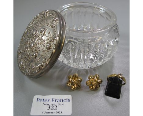 Glass dressing table jar with repousse plated top containing 14ct gold ring set with a white stone and a pair of 9ct gold ear