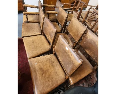 Set of eight oak and leather Cromwellian style dining chairs, having bobbin turned supports.  (6+2) (8)  (B.P. 21% + VAT) 