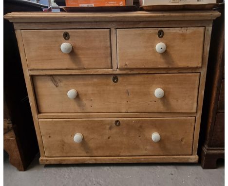 Late Victorian pine straight front chest of two short and two long drawers with ceramic nob handles.  86x45x78cm approx.  (B.