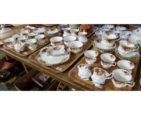 Three trays of Royal Albert English bone china 'Old Country Roses' design items to include: teacups and saucers, sugar bowls,