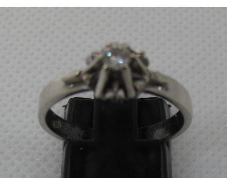 18ct white gold and diamond solitaire ring.  Ring size P.  Approx weight 4.1 grams.(B.P. 21% + VAT) 