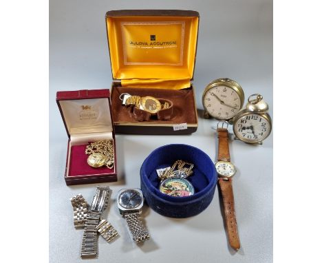 Bulova Accutron tuning fork mid century gilt metal gents day date wristwatch in original box, a Swiza Mignon alarm clock, an 
