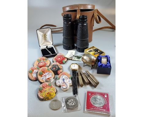 Box of oddments, to include: GB crowns, Welsh sterling silver love spoon pendant, eastern papier-mache masks, empty cartridge