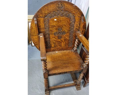 Early 20th century carved oak Monk's bench/armchair, on barley twist supports.  (B.P. 21% + VAT) 