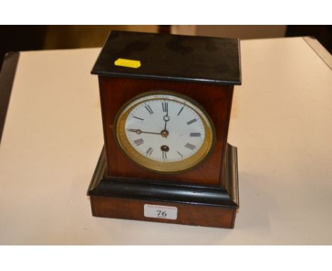 A late Victorian walnut and ebonised single hole mantle clock
