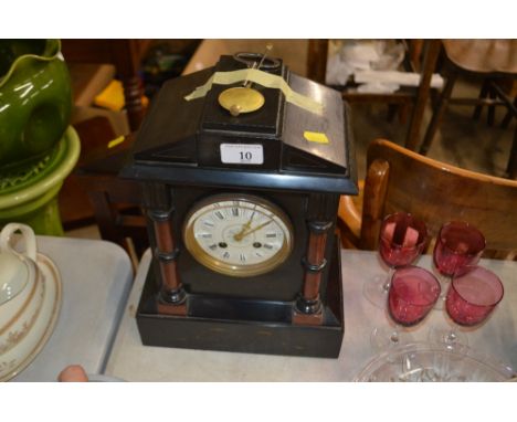 A black slate and marble two hole mantle clock