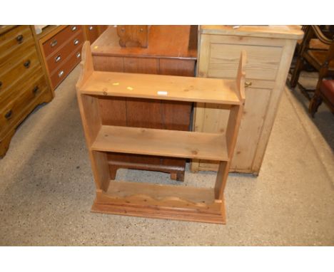 A stripped pine two tier shelf