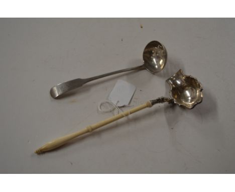 A George III Scottish silver sifter spoon, Edinburgh 1812; and a 19th century white metal side pouring ladle with turned ivor