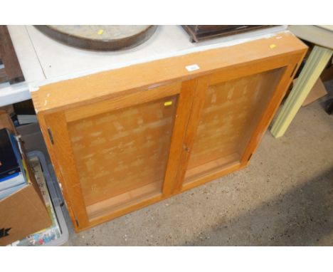 A light oak and glazed display cabinet 