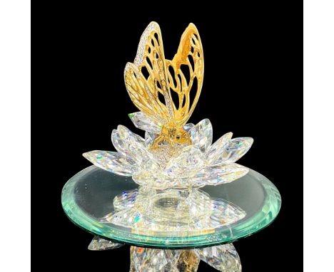 Spectacular cut crystal figure of a gold butterfly in the middle of a lotus flower. Small crystals fill the center of the flo
