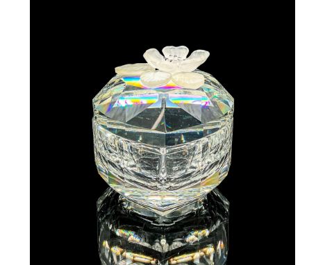 Clear faceted crystal box with lid. A frosted flower and leaves adorn the lid. Retired. Swarovski mark. Item number 7465NR052