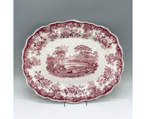 An oval serving tray decorated in a pink village scene and floral scrolls. Copeland Spode backstamp. Issued: 1962-1985Dimensi