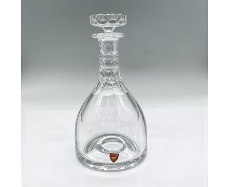 Elegant clear crystal decanter with stopper, thumbprint pattern on neck. Orrefors mark. Issued: 1981-2001Dimensions: 8"H x 4"