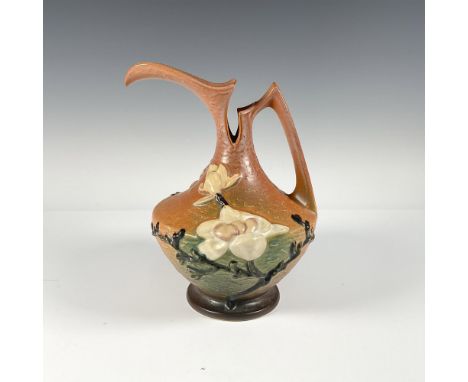 Handled pitcher with serrated opening including raised mark Roseville USA 10". Matte finish. Issued: 20th centuryDimensions: 