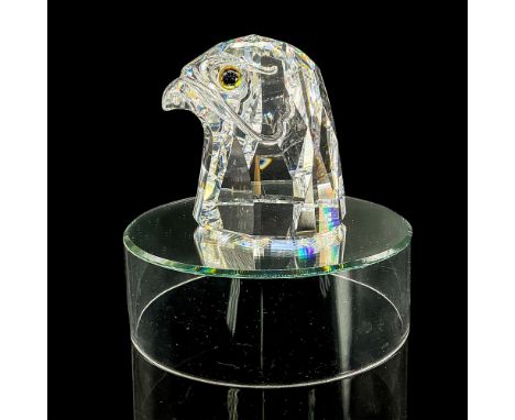 Clear crystal bust of a falcon head with blue/yellow/green glass eyes. Retired. Swarovski mark. Item number 7645NR100. Part o
