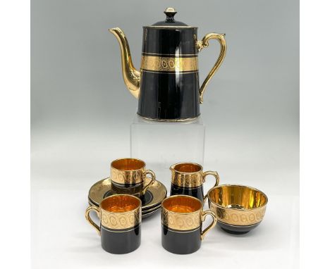 Sevres porcelain coffee set in black with gold handles and floral design borders. Gibson &amp; Sons backstamp. Coffee pot wit