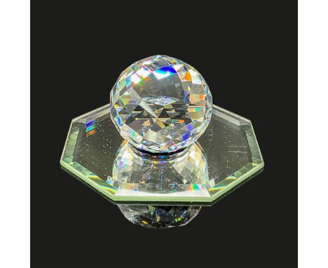 Sparkling clear cut crystal Collector's Society paperweight with the iconic swan logo in black. This item has its original bo