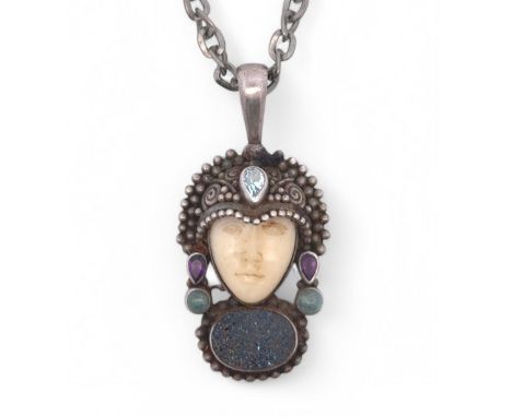 A Bajun silver pendant necklace. In the form of a man's head wearing a helmet set with gemstones and with a druzy stone set b