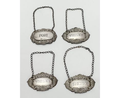 Four silver decanter labels, Two whisky and a brandy label, all by W I Broadway &amp; Co, Birmingham 1984, and a port decante