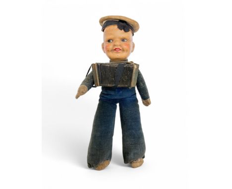 Finnish sailor with accordion doll with bisque head. Accordion plays when squeezed. Height 25cm.