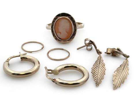 A 9ct gold and cameo ring size R, with three pairs of earrings 3.44g. A pair of 9ct leaf shaped pendant earrings, hoopw earri