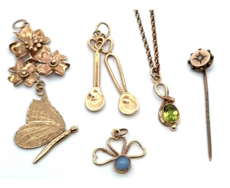 Three gold pendants, a peridot necklace on a 9ct gold chain and a tie pin.Gross weight not including tie pin 7.76g.