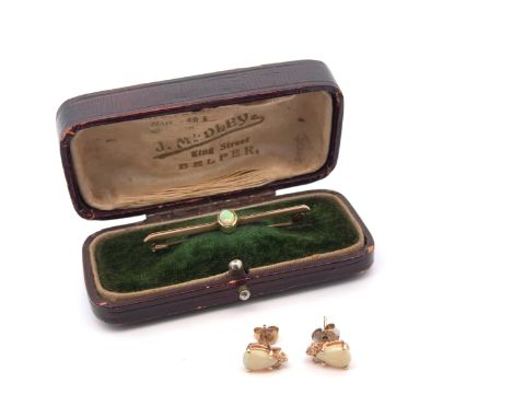A pair of pear shaped opal and diamond stud earrings, stamped 14ct gold 1.42g.. One of the butterfly backs is a replacement u