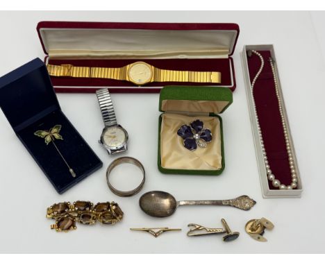 A small collection of silver, costume jewellery and watches. Includes a silver spoon, silver napkin ring, Fero watch, Mistas 