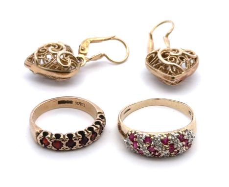Two 9ct gold and red stone rings. A ruby and diamond ring size P, and a garnet seven stone ring size K. Gross weight 5.33g. A