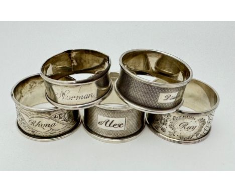 Five silver napkin ring holders, cartouches inscribed with names.