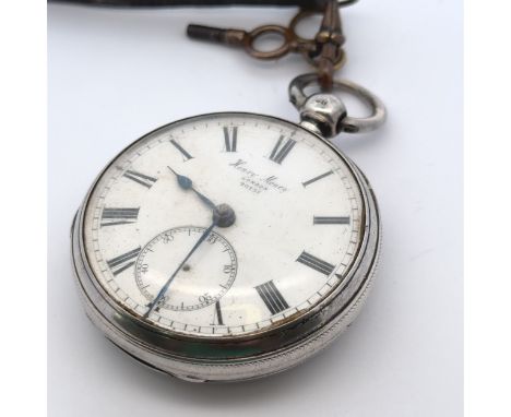 A silver key wind pocket watch inscribed to white enamel dial 'Henry Money, London 20757.' Roman numeral hour markers, blue s