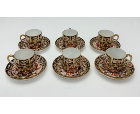 A set of six Royal Crown Derby demitasse coffee cups and saucers in the traditional Imari pattern, 2451. Good condition with 