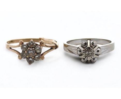 Two gold and white stone rings. A diamond illusion ring size K/L, stamped 18k, 3.2g, And a hallmarked 9ct CZ cluster ring siz