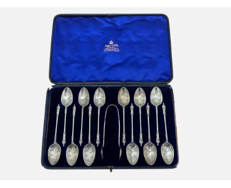 A Victorian Mappin &amp; Webb cased set of twelve silver apostle spoons and sugar tongs. Sheffield 1897. 