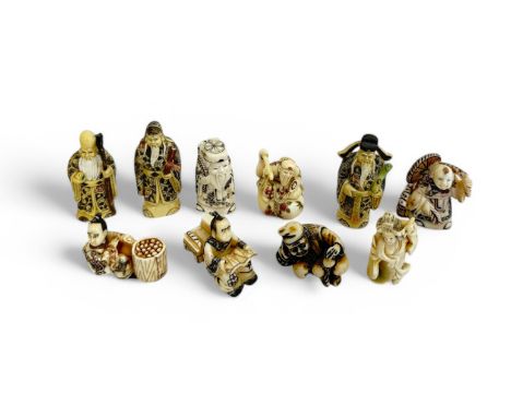 Ten Japanese resin Netsuke figures with etched decorations. Tallest 7cm. (10)
