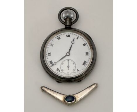 A silver pocket watch with white enamel dial and Roman numeral hour markers. Inner case with 1925 London import hallmarks and