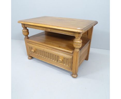 A mid-century Ercol drop-leaf coffee table, with single frieze drawer and carved linenfold decoration. 74x49x47cm 