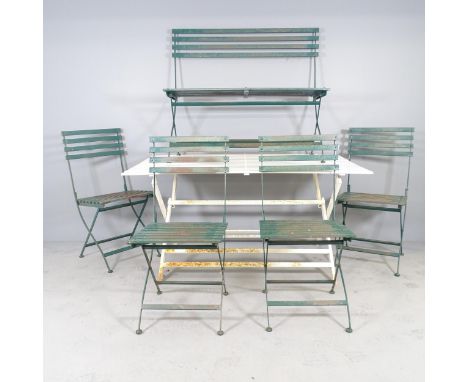 A painted metal folding garden table, 150x74x87cm, a folding bench, length 110cm and four matching folding chairs. 