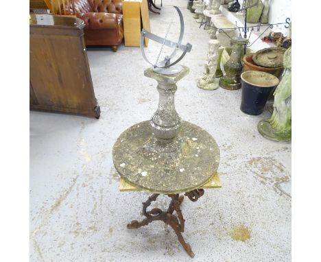 A weathered concrete sundial garden ornament, height 76cm, and an oak topped garden table cast iron base. (2) 