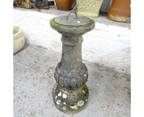 A verdigris metal sundial on weathered concrete plinth. Height 78cm 