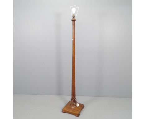A turned stained pine standard lamp on pedestal base. Height 160cm 