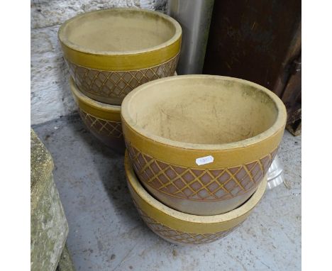 A set of four glazed ceramic garden planters. 30x24 