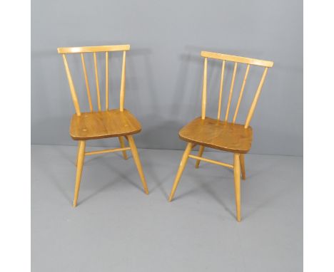 A pair of mid-century Ercol elm and beech chairs. 