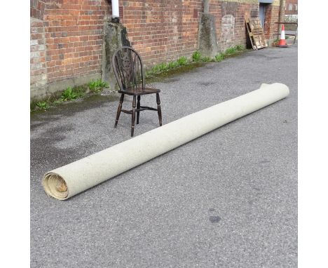 A roll of taupe carpet, 440x360. Pile depth approximately 0.8cm.Chair for scale - not included in lot. 