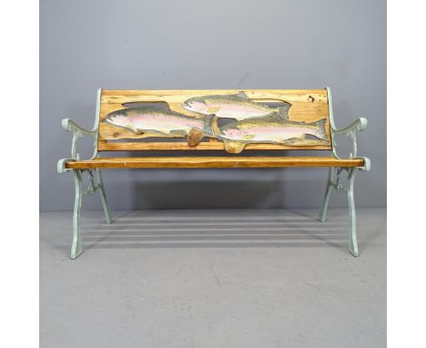 A teak slatted garden bench with cast iron ends, and painted Fish decoration, by Clive Fredriksson. 124x74x55c,m 