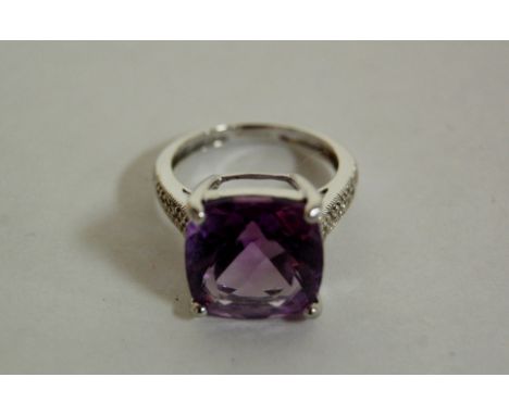 A ladies 9ct  white gold amethyst set dress ring, 4.7g