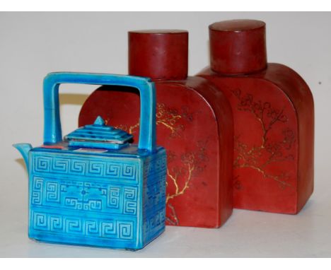 Two modern lacquered Chinese tea canisters together with a blue glazed Chinese teapot (2) Condition Report / Extra Informatio