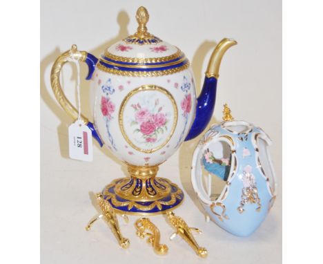 A House of Faberge The Faberge Egg Imperial Teapot together with a decorative porcelain egg (2)